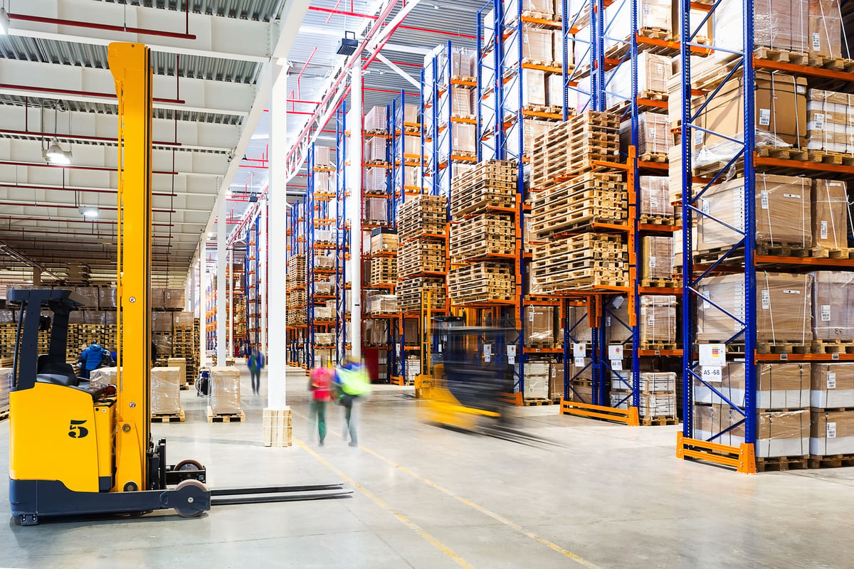 Warehouse manager checking inventory on a tablet